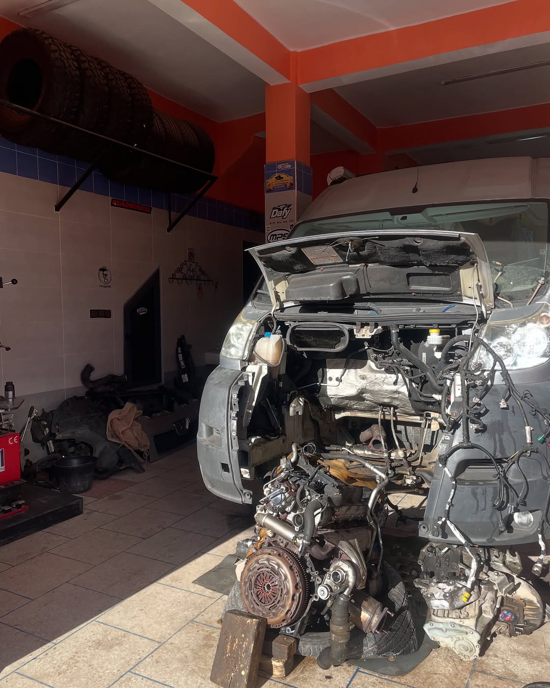Peugeot Boxer engine and gearbox laid out in front of the van during the engine swap at Garage Iriki