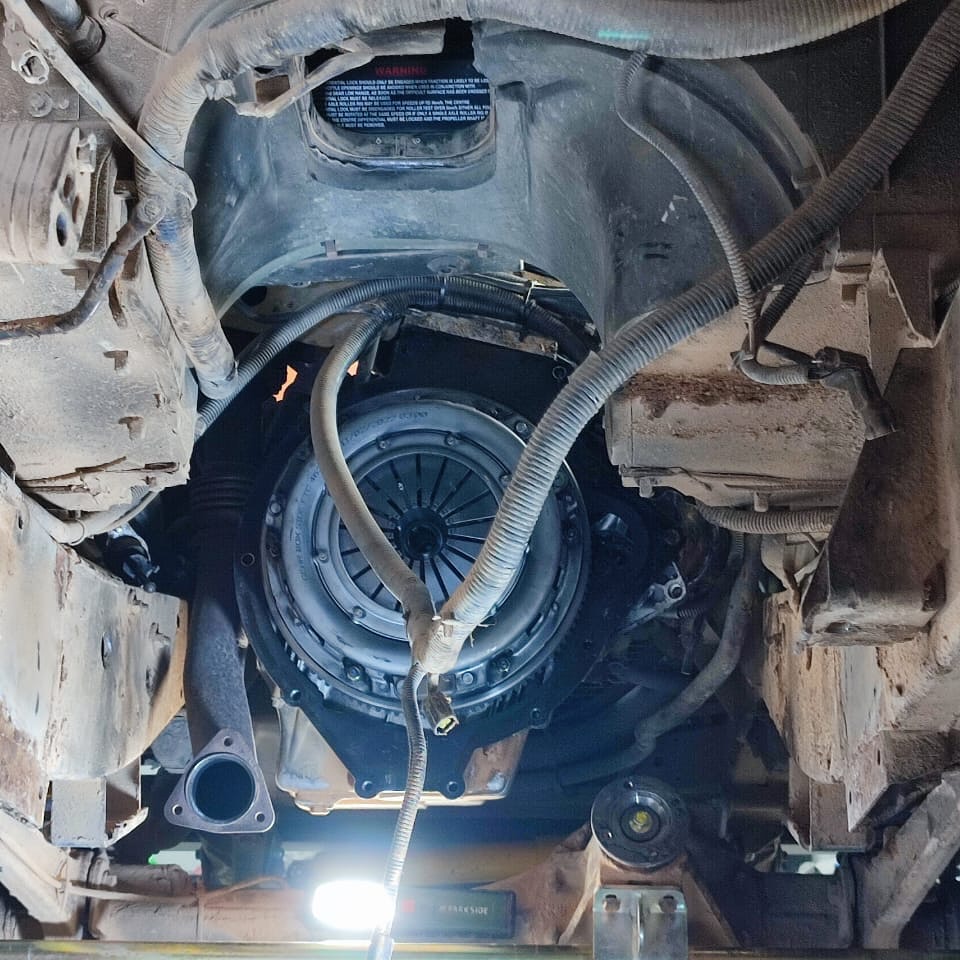 Underside view of the Land Rover Defender clutch and bellhousing during the gearbox swap